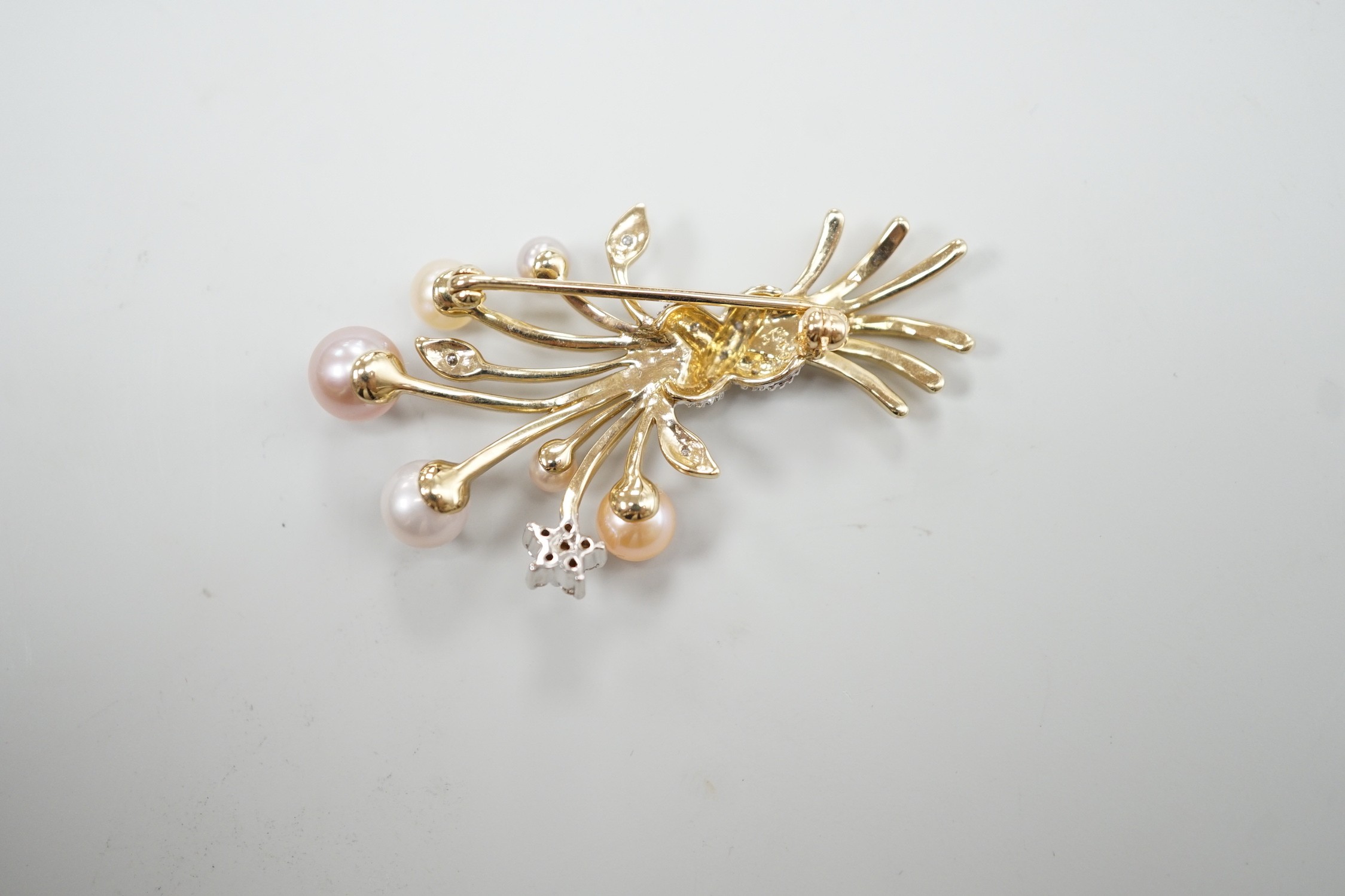 A modern 375 yellow metal, diamond chip and multi coloured graduated cultured pearl set spray brooch, 45mm